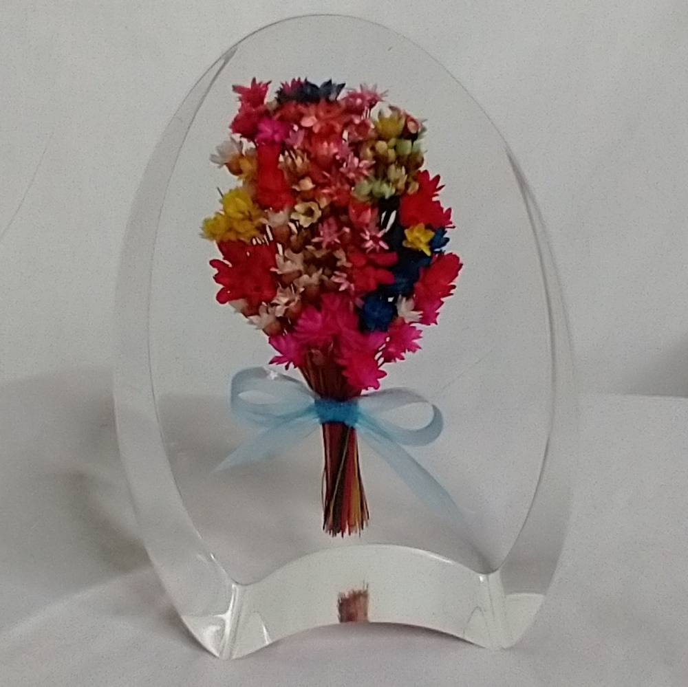 Pretty bouquet of flowers in lucite paperweight